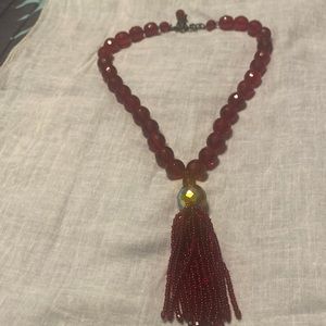 Red beaded necklace.